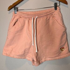Dippin' Daisy's strawberry-embroidered sweat shorts in a pink color